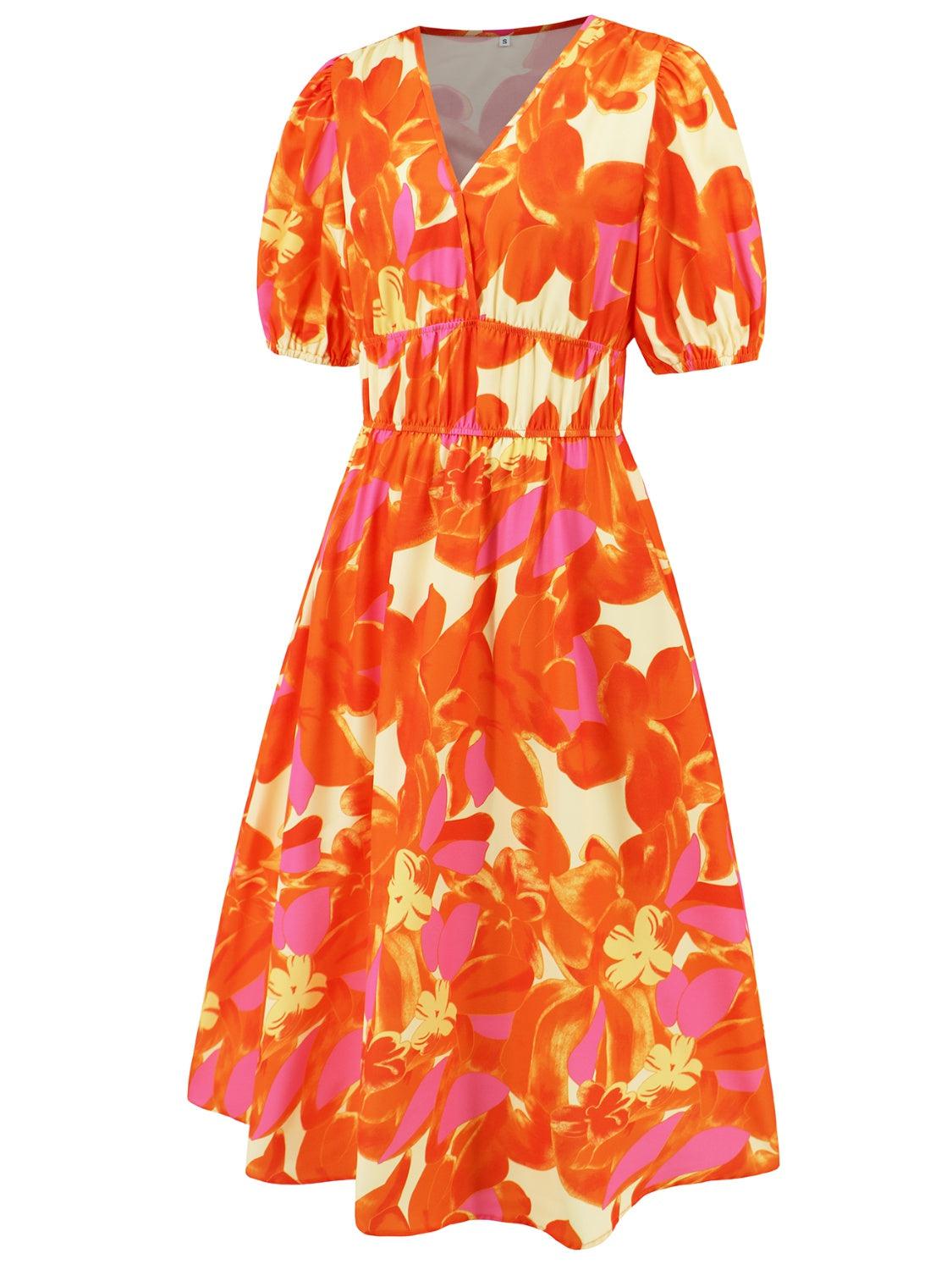 an orange and pink dress with flowers on it