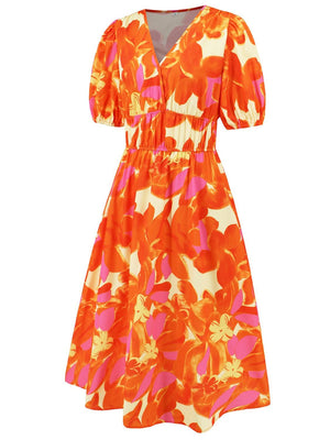 an orange and pink dress with flowers on it