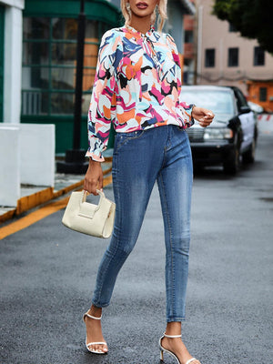 a woman is walking down the street with a handbag