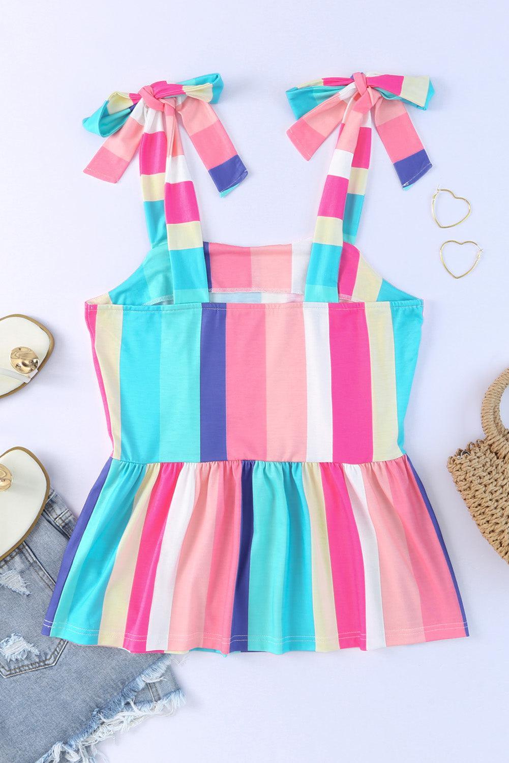 a little girl's dress and sandals on a white surface