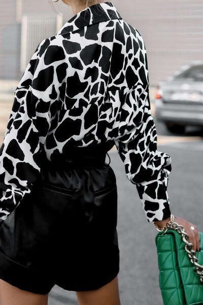 a woman walking down a street holding a green purse