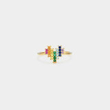 a gold ring with multicolored stones