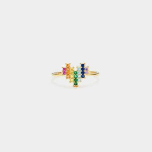 a gold ring with multicolored stones