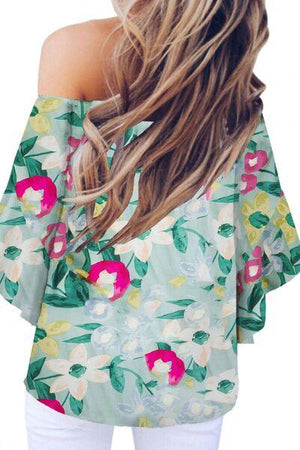 the back of a woman's top with flowers on it