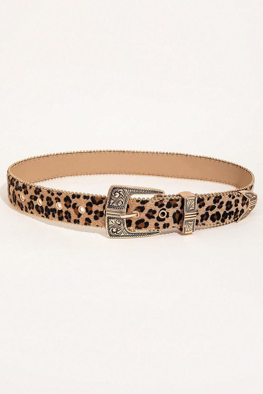 a leopard print belt with a metal buckle