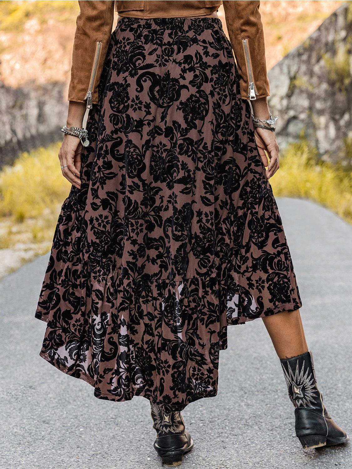 a woman in a skirt and boots walking down a road