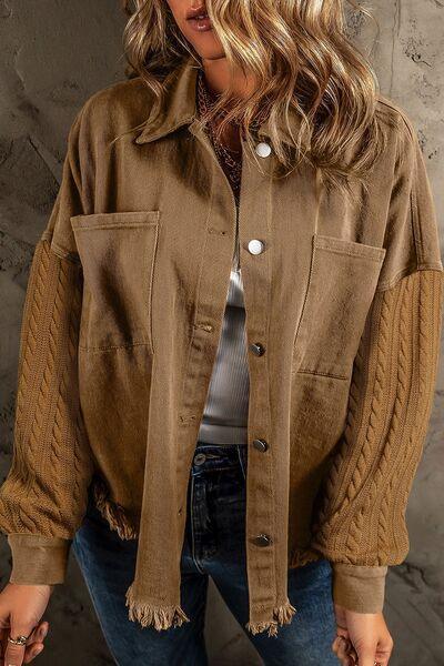 a woman wearing a brown jacket and jeans