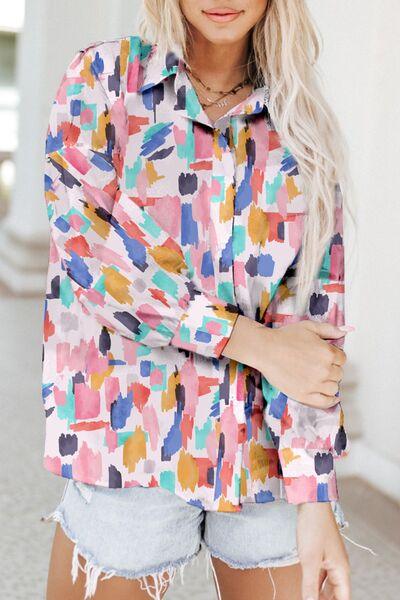 a woman with blonde hair wearing a colorful shirt