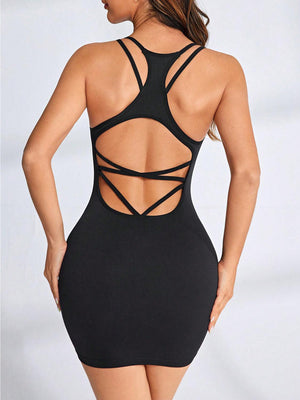 a woman wearing a black bodysuit with a cut out back