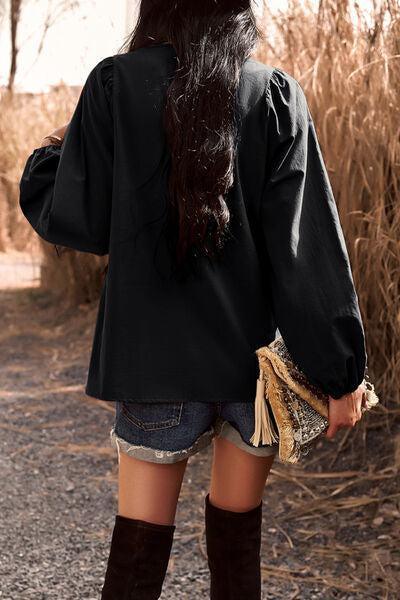 a woman with long dark hair and boots