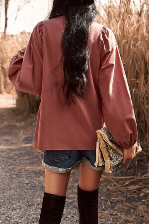 a woman with long black hair and boots