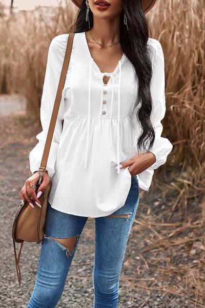 a woman wearing a hat and jeans