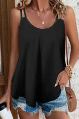 a woman wearing a black tank top with ripped shorts