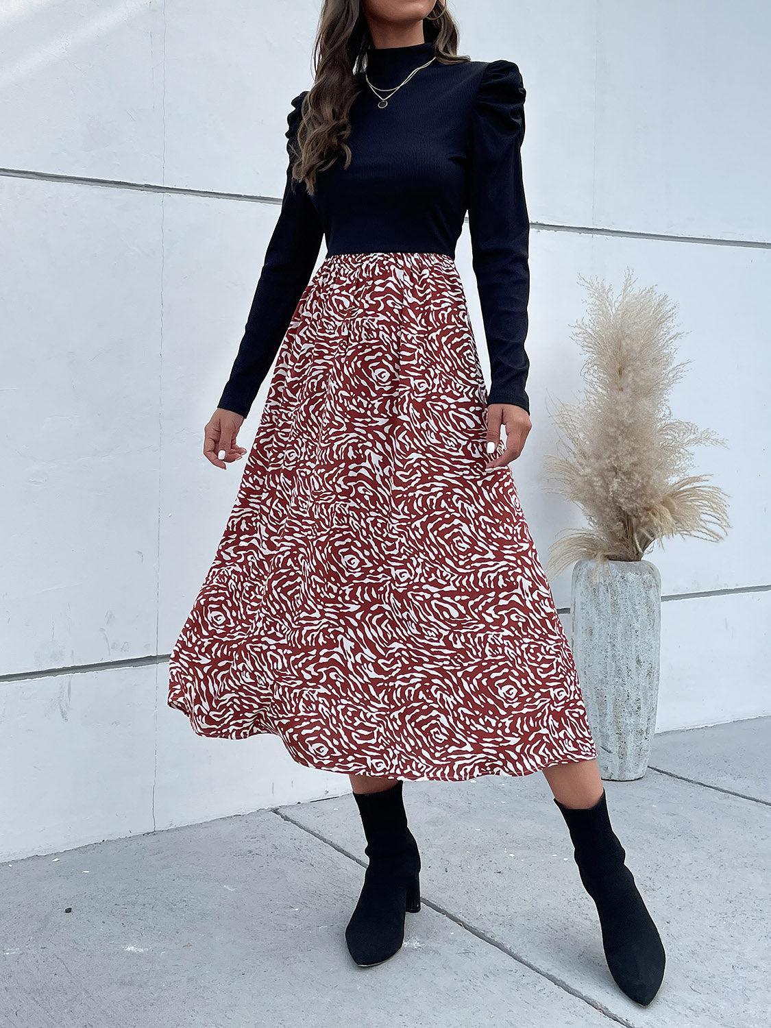 a woman in a black top and a red and white skirt