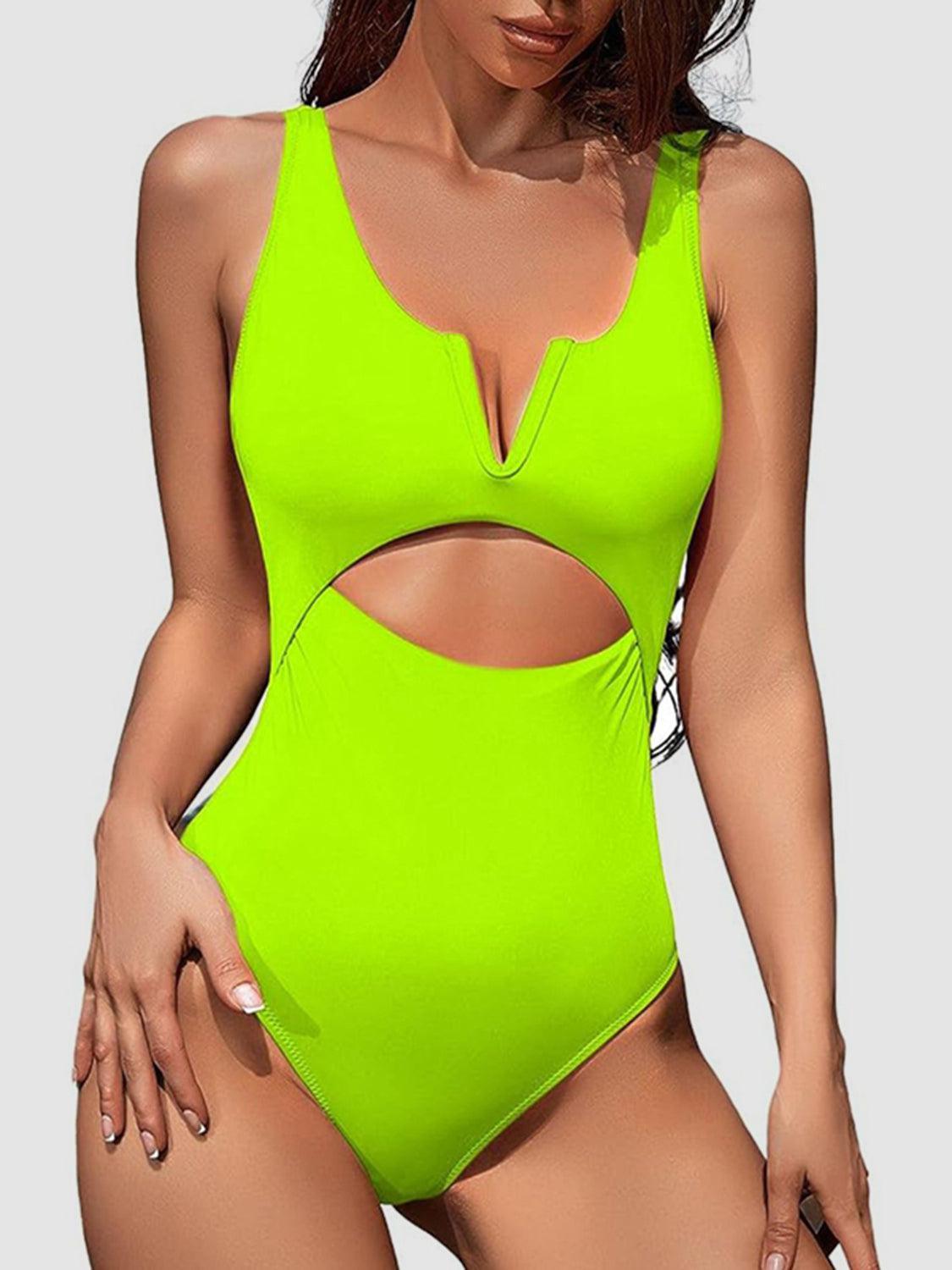 a woman in a neon green swimsuit