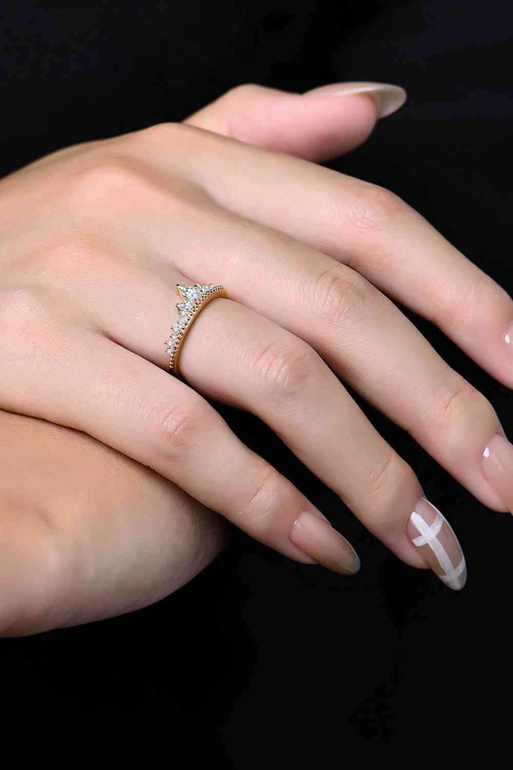 a woman's hand with a ring on it