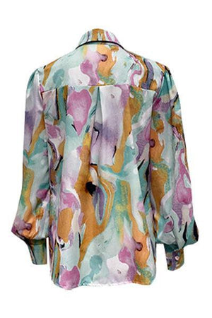 a women's blouse with a floral print