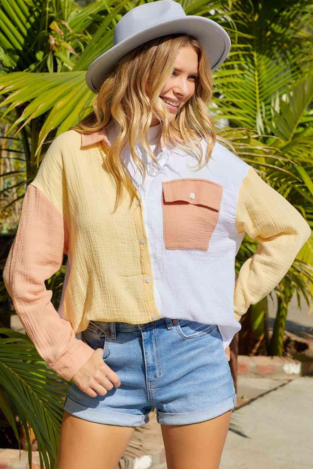 a woman wearing a hat and denim shorts