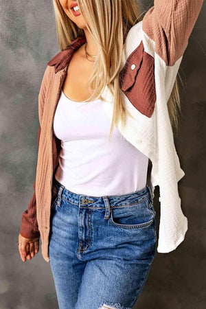 a woman posing for a picture in a white shirt and jeans