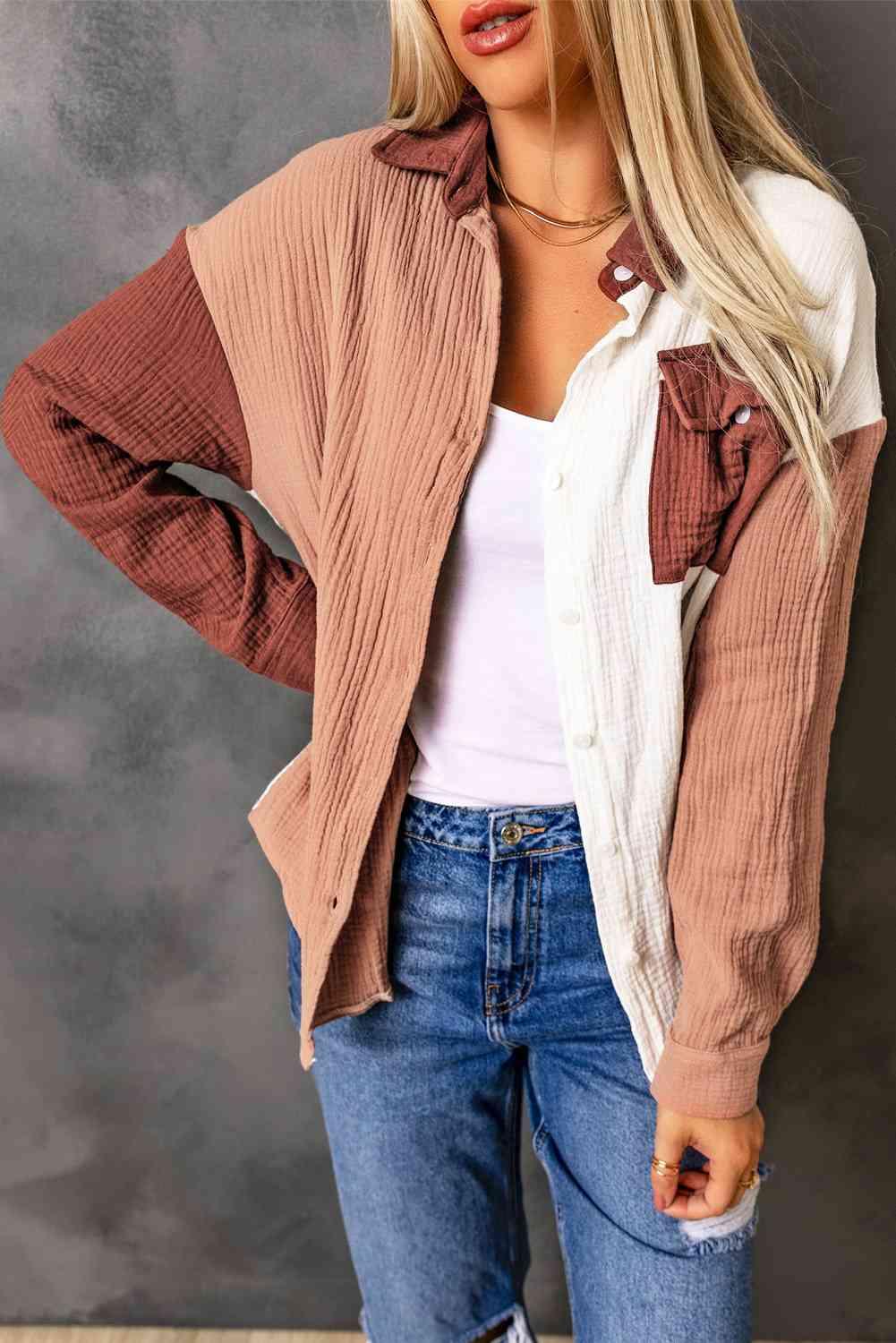 a woman wearing a brown and white jacket