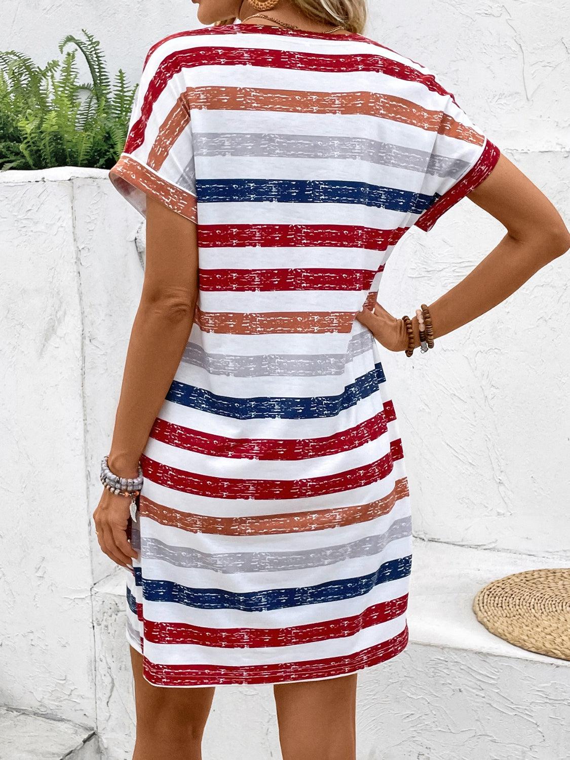 a woman wearing a red, white, and blue striped dress