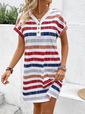 a woman wearing a red, white, and blue striped dress