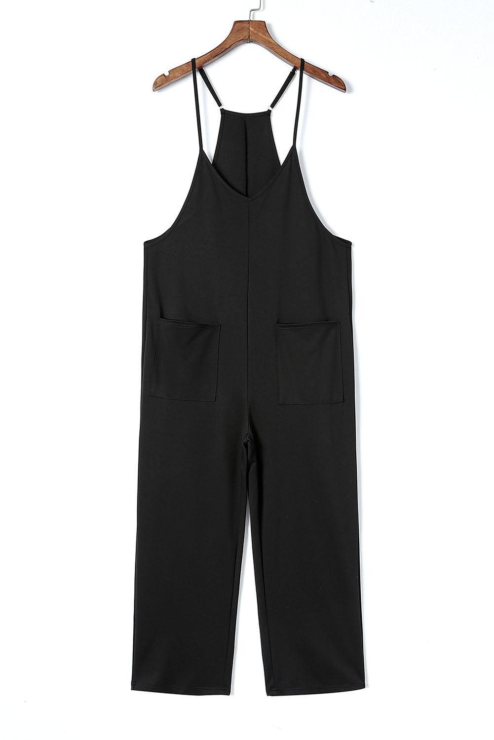 a black jumpsuit hanging on a hanger