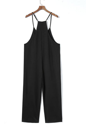 a black jumpsuit hanging on a hanger