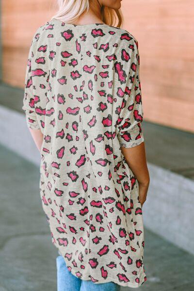 a woman wearing a leopard print top