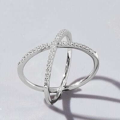 a white gold ring with diamonds on a white background