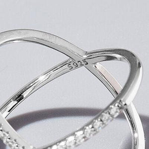 a close up of a diamond ring on a table