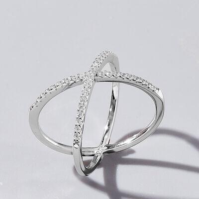 a white gold ring with diamonds on a white background