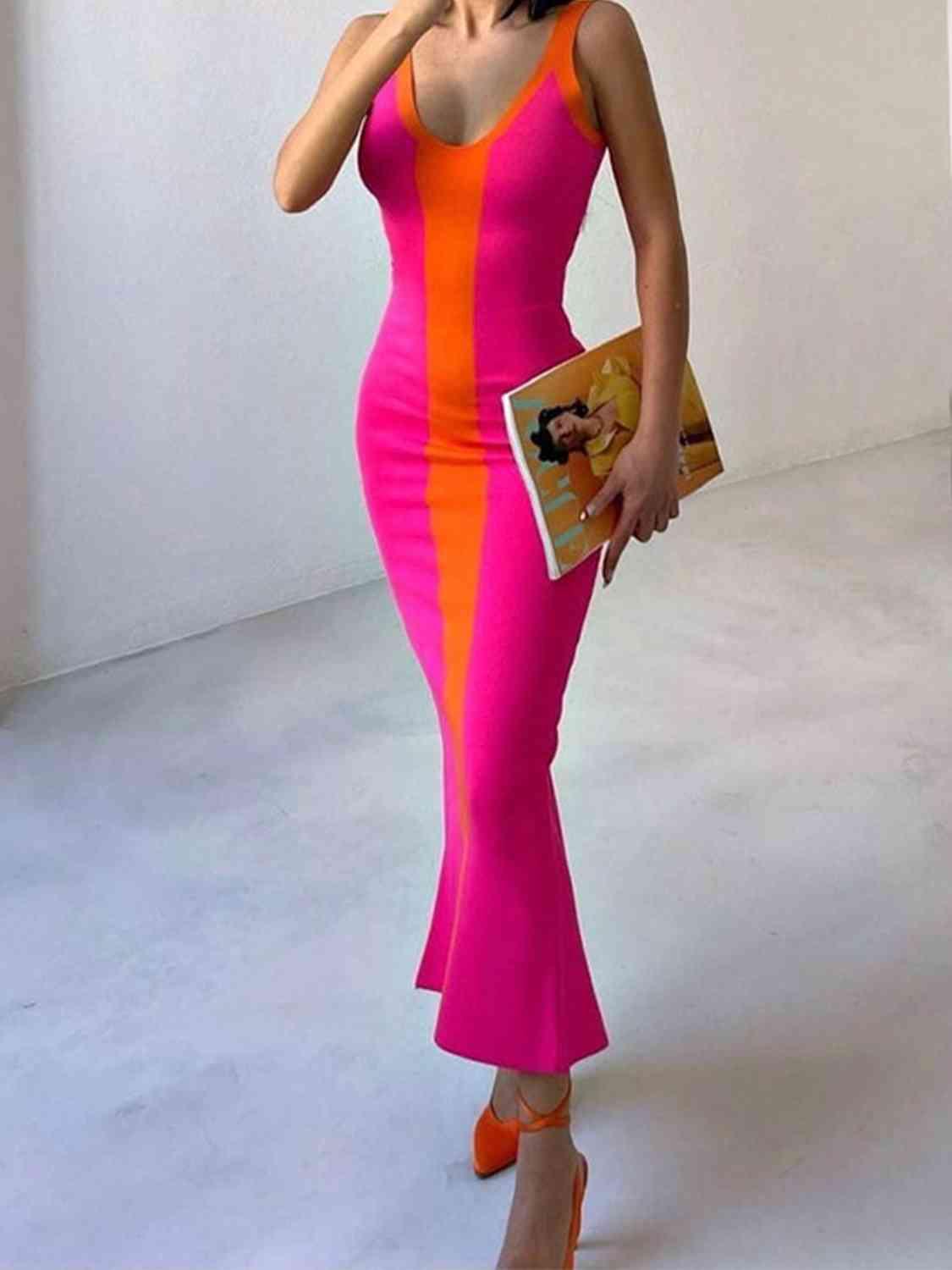 a woman in a pink and orange dress