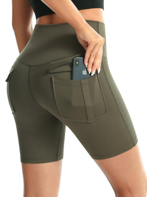 a woman is holding a cell phone in her pocket
