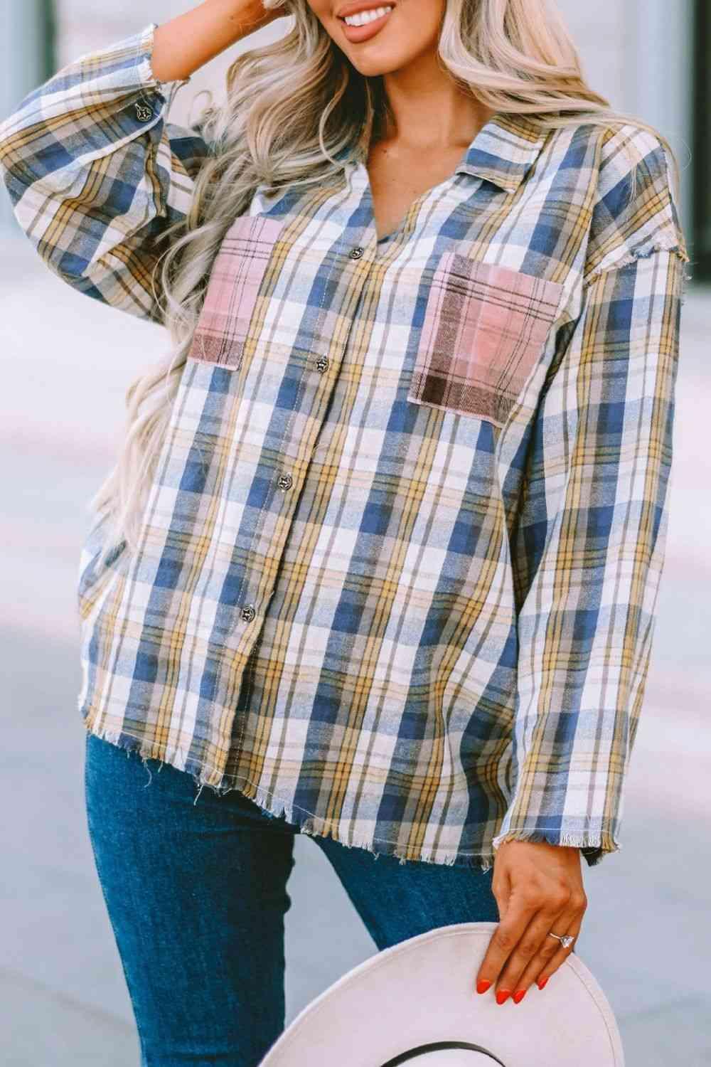 a woman wearing a plaid shirt and hat