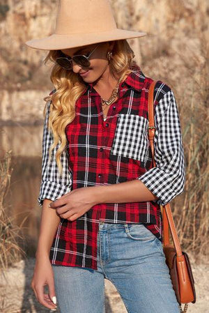 a woman wearing a hat and a plaid shirt