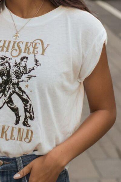 a woman wearing a whiskey shirt and jeans