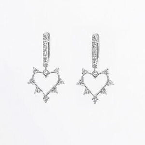 a pair of heart shaped earrings with diamonds