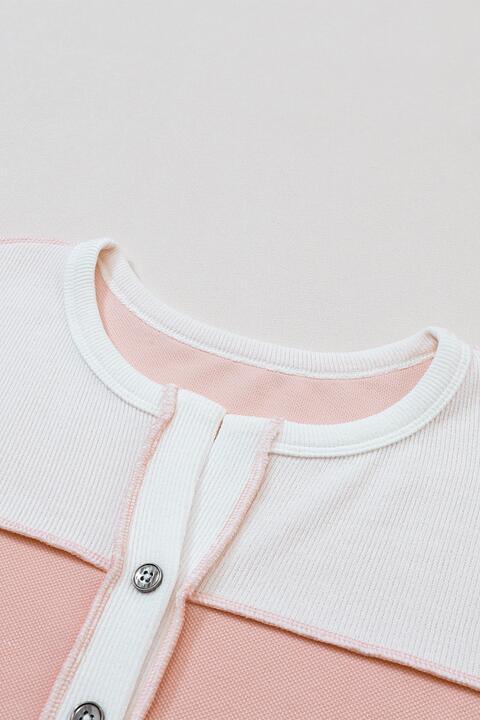 a close up of a pink and white shirt