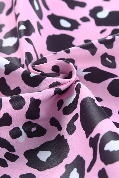 a pink and black animal print fabric