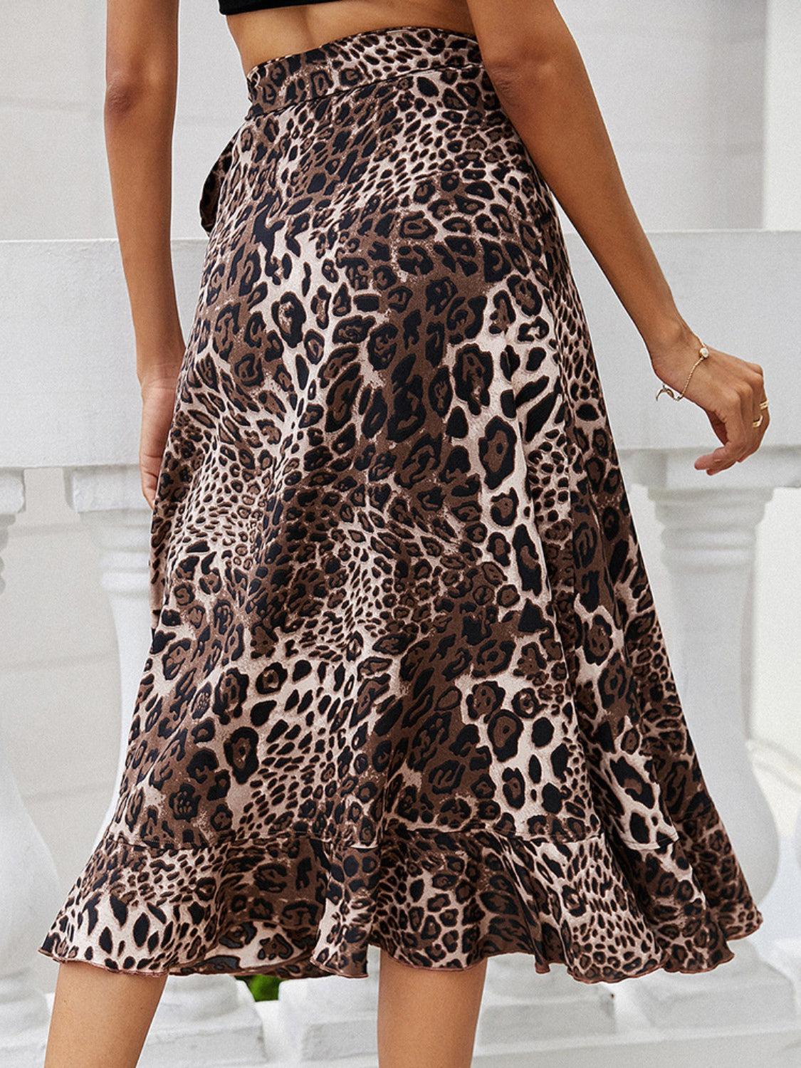 a woman wearing a leopard print skirt