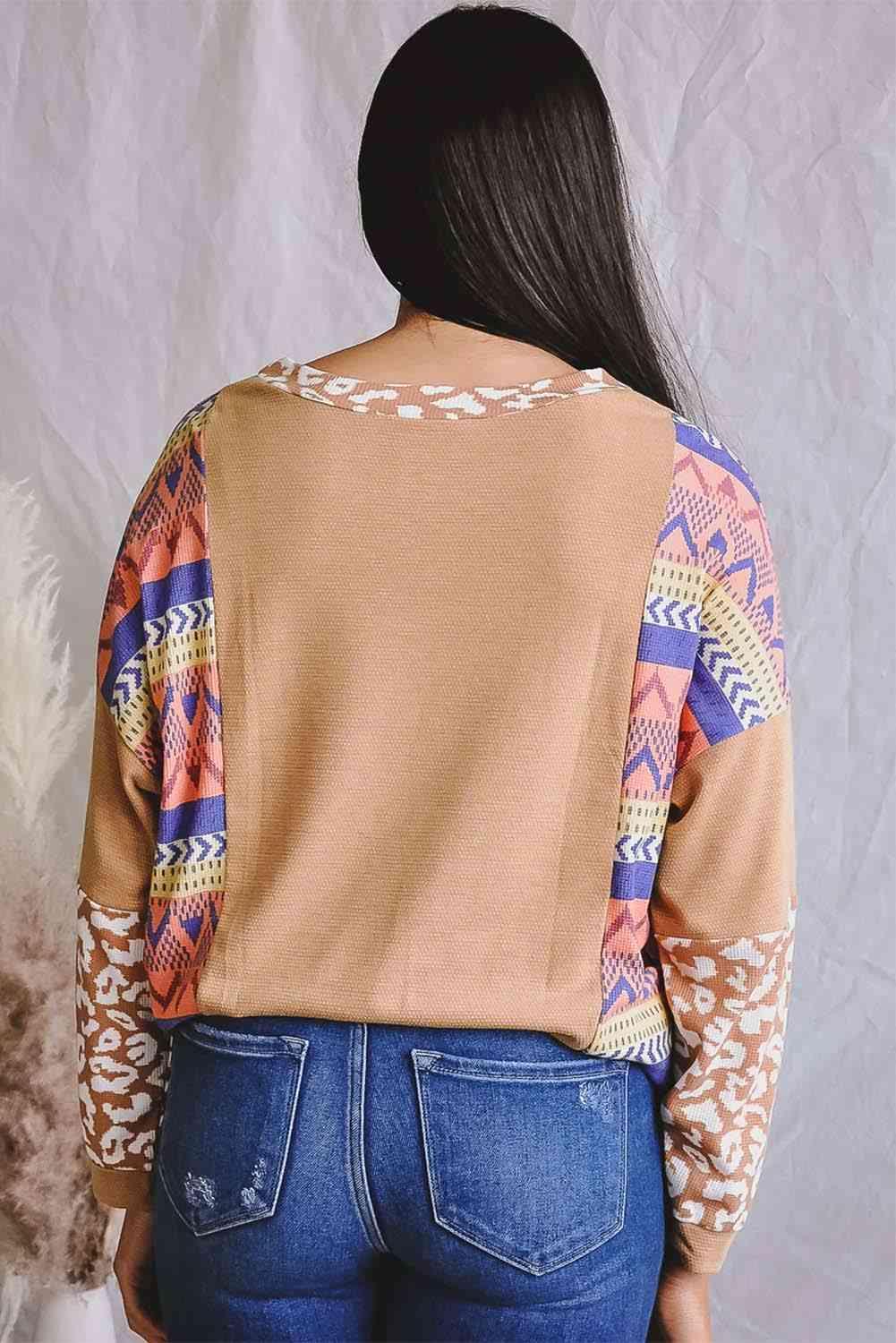 the back of a woman's jacket with a pattern on it