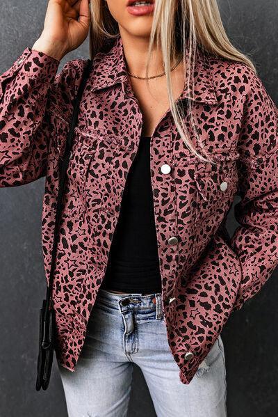 a woman wearing a pink leopard print jacket