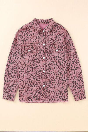 a pink jacket with black spots on it