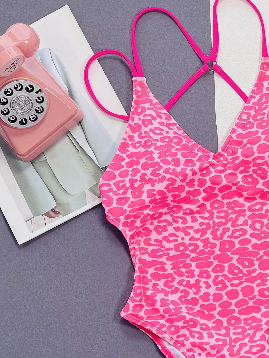 a pink and white bathing suit and a pink phone