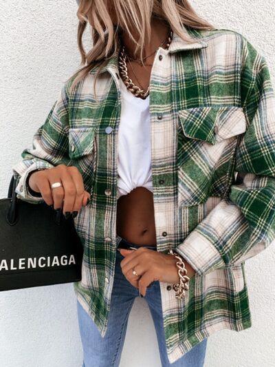 a woman wearing a green plaid shirt and jeans