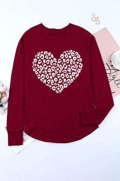 a red shirt with a white heart on it