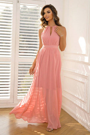 a woman in a pink dress posing for a picture