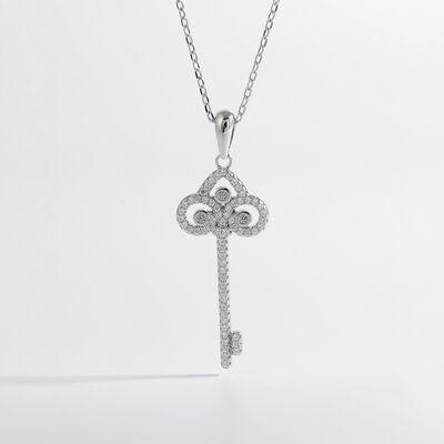 a diamond key pendant on a chain