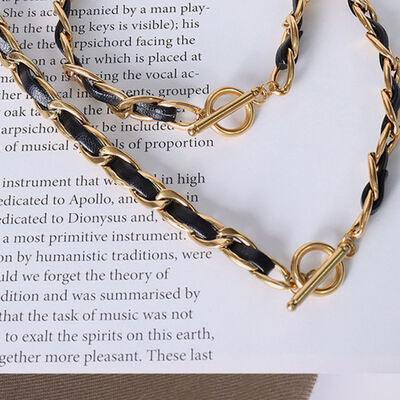 a close up of a book with a chain on it